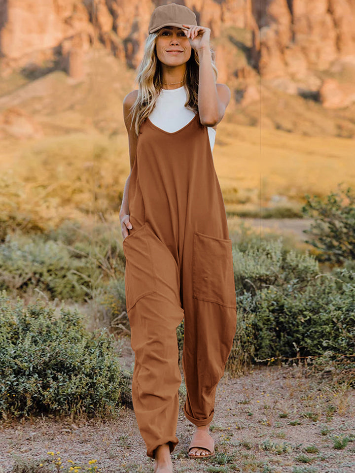 This Sunrise jumpsuit features a striking V- neckline, pockets and lots of stretch for added comfort, this full-size sleeveless jumpsuit comes in a variety of colors. Our Sunrise jumpsuit is stylish, comfortable and its lightweight fabric makes it ideal for summer or fall events, such as brunch or a family BBQ. Style with a bag and your favorite sandals for a complete look.