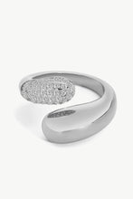 Load image into Gallery viewer, A simplistic yet elegant ring with a geometric style featuring a bypass design fashioned from polished stainless steel and crystals.
