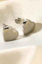 Load image into Gallery viewer, Complete your look with these stylish silver stud earrings. Pryceless Creations Clothing classic heart studs adds a bit of extra elegance to these stud earrings that we love! 
