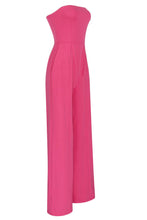 Load image into Gallery viewer, No matter the occasion, the All Inclusive Strapless Jumpsuit is sure to impress!  Featuring ahugging figure with an invisible zip closure at back, princess-seamed bodice with an elasticized back, strapless and welt pockets detailing. This endless strapless jumpsuit in classic solid color is perfect from day to night. Complete it with a mini clutch and heels for a sophisticated look. 
