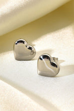Load image into Gallery viewer, Complete your look with these stylish silver stud earrings. Pryceless Creations Clothing classic heart studs adds a bit of extra elegance to these stud earrings that we love! 
