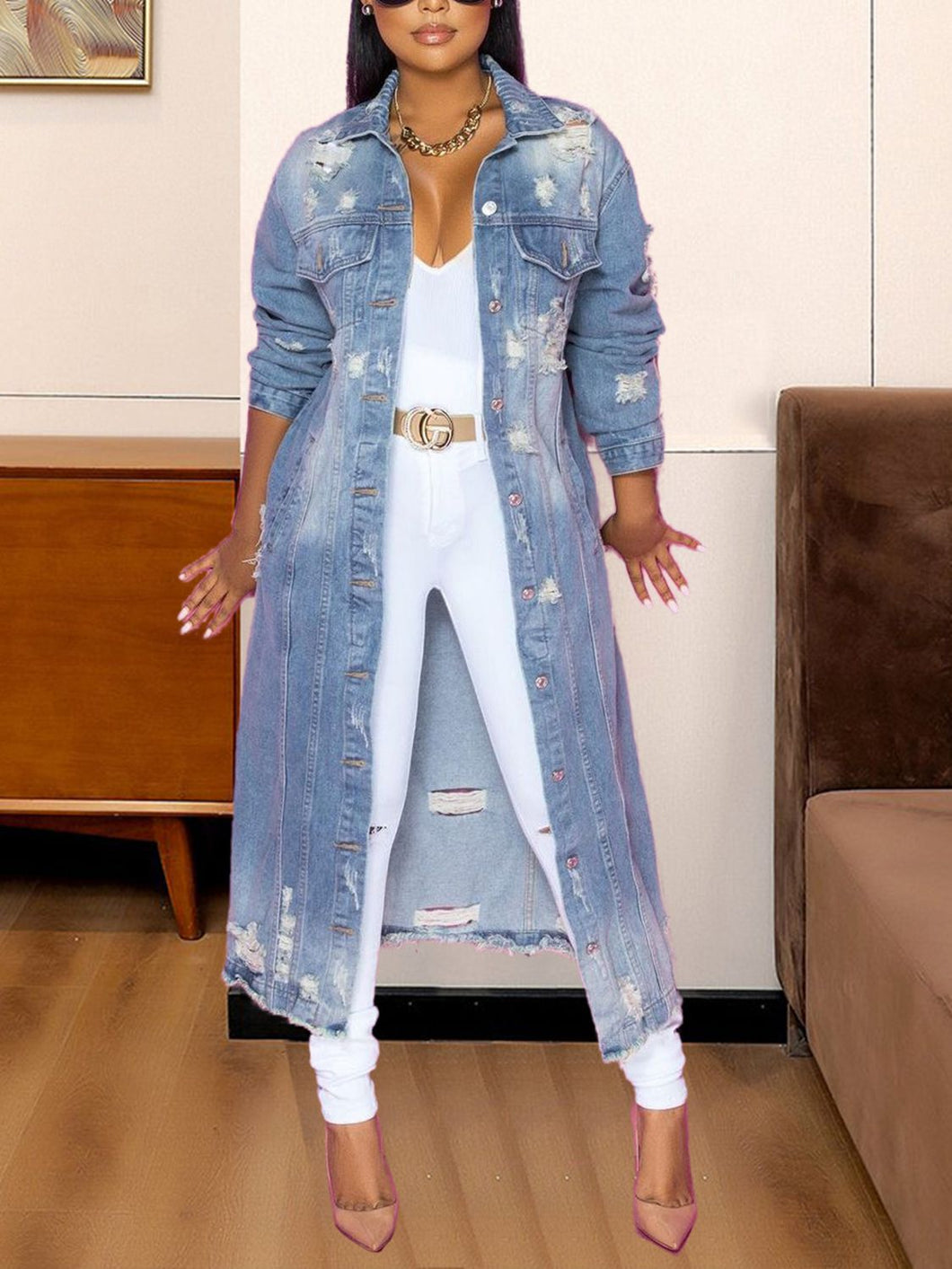 Take your outfit of the day to a whole new level, be sure to gain all the style credentials, regardless of your agenda. Crafted from a light blue denim fabric, with a button-down silhouette and a relaxed fit, this distressed jacket will be sure to captivate all the attention. Elevate your look with this jacket, teamed with a denim skirt, clear heels, and gold hoop earrings - a combination that we simply adore.