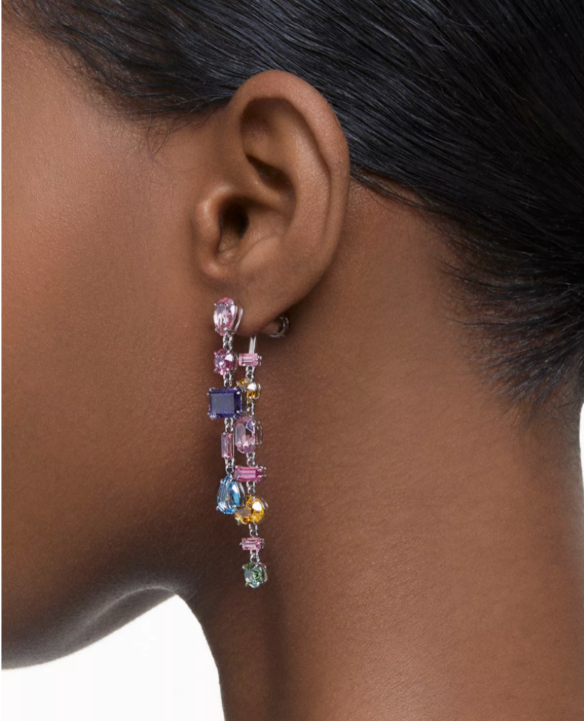 These multicolored drop earrings feature a mix of oval, pear, emerald and navette-cut crystals, arranged in a random formation. An elegant yet playful twist on the essence of Swarovski crystals, wear yours with an off-the-shoulder top to highlight their pastel hues and kinetic craftsmanship.