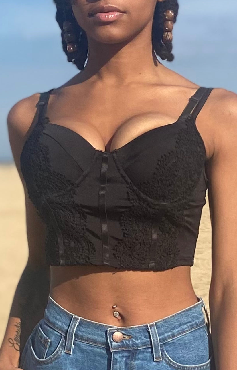 We are obsessed with this sexy lace cami tank top for the upcoming season. Featuring a black material with lace trim detailing, sweetheart neckline, and a padded cup design, we are in love. Wear with your go-to jeans and strappy heels for the perfect brunch date look.