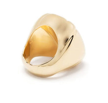 Load image into Gallery viewer, Inspired by sculpture from the Pop Art movement, this cocktail ring is playfully and unexpectedly soft in shape. A single precision cut Champane crystal is cushioned in a glossy molded setting and finished with a tonal band and brass inlay. For a striking statement wear yours alone. 
