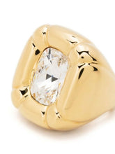 Load image into Gallery viewer, Inspired by sculpture from the Pop Art movement, this cocktail ring is playfully and unexpectedly soft in shape. A single precision cut Champane crystal is cushioned in a glossy molded setting and finished with a tonal band and brass inlay. For a striking statement wear yours alone. 
