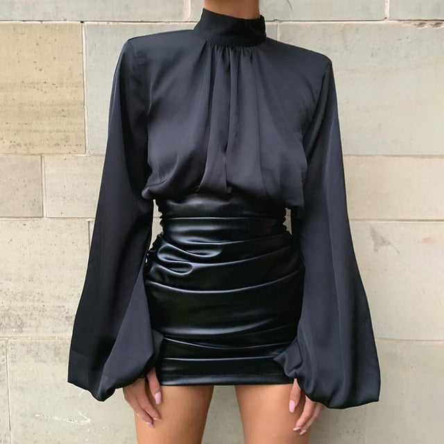 Girl we are lovin' this She's So Classy Blouse crop top, featuring a black satin material, with a turtleneck collar. Team this with matching satin trousers and killer heels for that last minute night out outfit. 