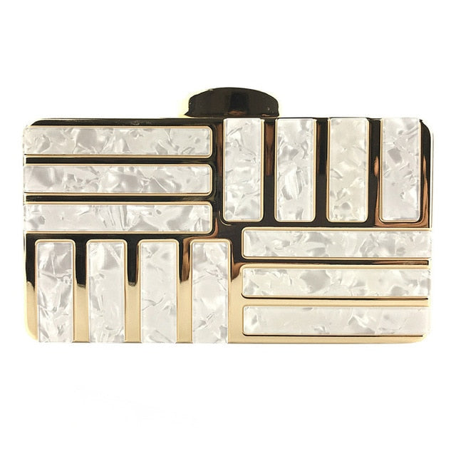 This marble acrylic clutch is elegant, glamorous and fashionable. A stylish and convenient addition to your accessory collection. With room for all your must-have gizmos, this rectangular purse has a removable crossbody strap and gold hardware.  Great present for your friend, your family or yourself. This unique & beautiful design will make you shine.