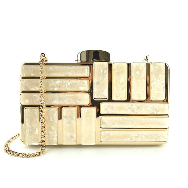 This marble acrylic clutch is elegant, glamorous and fashionable. A stylish and convenient addition to your accessory collection. With room for all your must-have gizmos, this rectangular purse has a removable crossbody strap and gold hardware.  Great present for your friend, your family or yourself. This unique & beautiful design will make you shine.