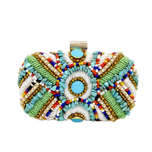 Become the ultimate trendsetter when pairing your outfits with our pretty Nubian multi color beaded clutch purse. Ideal for babe's who love a colorful wardrobe. Featuring a turquoise jewels, colorful beaded detailing, and with a hasp snap closure. This purse pairs perfectly with a any dress and some sexy high heels and some accessories to complete the look.