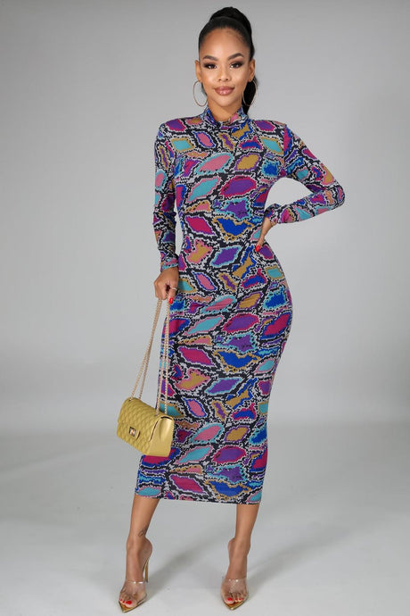 Colorful Jungle Body Dress Dress - Multi Color  Keep it comfy but chic in this sexy bodycon snake print dress. Not only is this dress versatile and easy to dress up or down it's also reversible too! This dress comes in a mini length featuring a crewneck neckline and long sleeve. Pair this with a pair of ankle boots for a casual look or high heels and handbag to dress it up! 