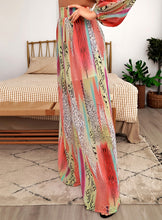 Load image into Gallery viewer, Your next vacation outfit is calling! Summertime doesn&#39;t get any prettier than this tropical print pant set! Featuring a fully-lined wide leg pant with a high rise fit, zip closure and matching crop top with back zip closure; we&#39;re obsessed! Style with a high heel and stylish handbag for a complete look. 
