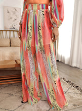 Load image into Gallery viewer, Your next vacation outfit is calling! Summertime doesn&#39;t get any prettier than this tropical print pant set! Featuring a fully-lined wide leg pant with a high rise fit, zip closure and matching crop top with back zip closure; we&#39;re obsessed! Style with a high heel and stylish handbag for a complete look. 
