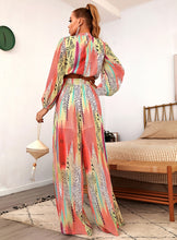 Load image into Gallery viewer, Your next vacation outfit is calling! Summertime doesn&#39;t get any prettier than this tropical print pant set! Featuring a fully-lined wide leg pant with a high rise fit, zip closure and matching crop top with back zip closure; we&#39;re obsessed! Style with a high heel and stylish handbag for a complete look. 

