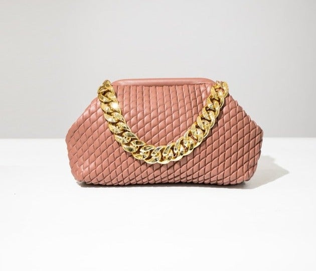 Complete your look with this chic faux leather bag featuring a thick gold chain and fully lined interior. Roomy enough to fit all of your day-to-day essentials. Pair with your little black dress for a night out or add some glitz and glam to your denim looks.