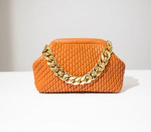 Load image into Gallery viewer, Complete your look with this chic faux leather bag featuring a thick gold chain and fully lined interior. Roomy enough to fit all of your day-to-day essentials. Pair with your little black dress for a night out or add some glitz and glam to your denim looks.
